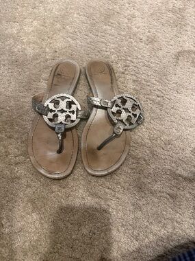 Tory Burch Metallic Snake-Embossed Logo Thong Sandals - Silver. Size 9